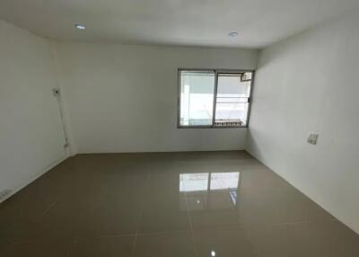 Empty room with tiled floor and window