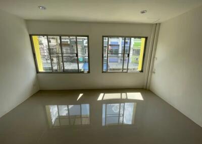 simple unfurnished room with large windows and tiled floor