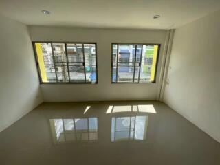 simple unfurnished room with large windows and tiled floor