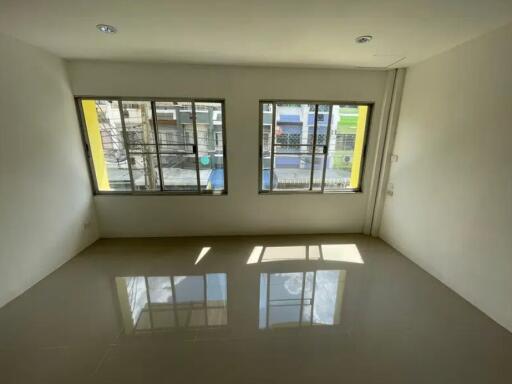 simple unfurnished room with large windows and tiled floor