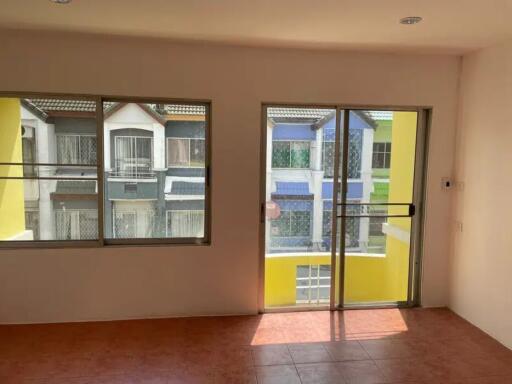 Living room with large window and sliding glass door