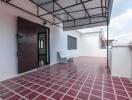 Spacious outdoor terrace with tiled flooring and seating