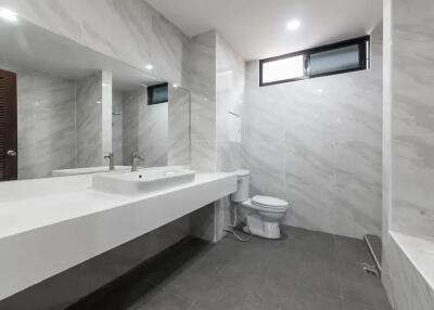 Modern bathroom with large mirror and clean design