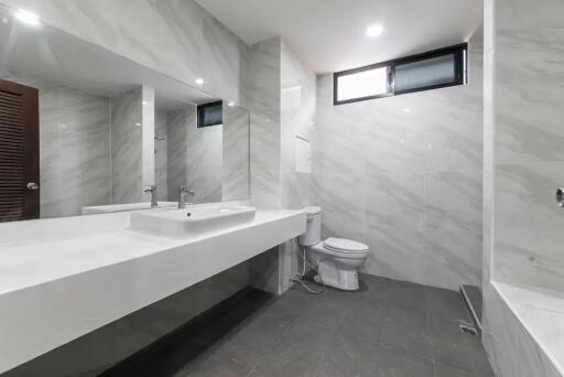 Modern bathroom with large mirror and clean design