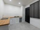 Minimalist kitchen with wooden countertop