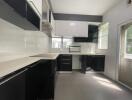 Modern kitchen with black and white cabinetry