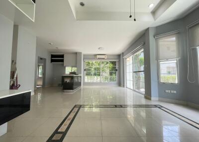 spacious living area with large windows and natural light