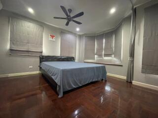 Spacious bedroom with double bed and ceiling fan