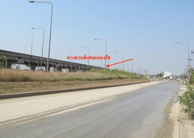 Highway view with greenery and street lamps