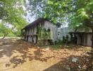 Old exterior structure surrounded by trees