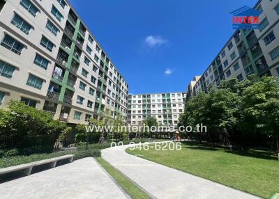 Exterior view of apartment buildings with green spaces