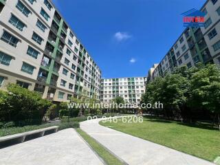 Exterior view of apartment buildings with green spaces