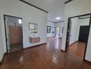 Interior view showing hallway, bathroom, and living area