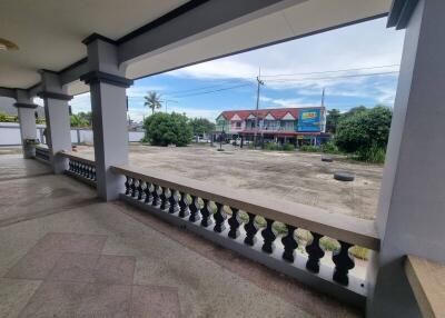 Balcony with view of street and nearby buildings