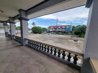 Balcony with view of street and nearby buildings