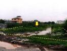 Vacant land plot with nearby buildings