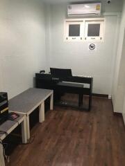 Music room with keyboard and seating