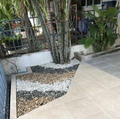 Patio area with tiled flooring and garden