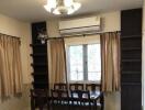 Dining room with wooden table, chairs, air conditioner, and chandelier