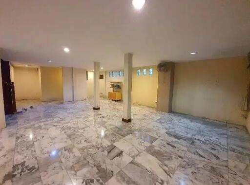 Spacious finished basement with marble flooring