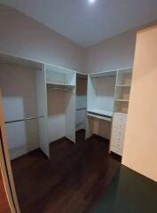 Walk-in closet with shelves and hanging space