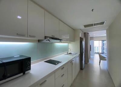 Modern kitchen with white cabinetry and appliances