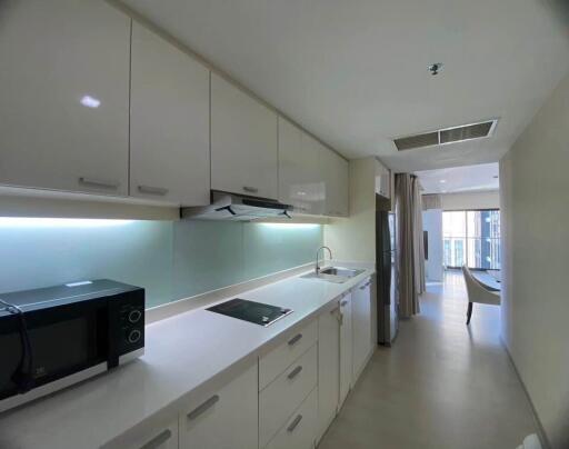 Modern kitchen with white cabinetry and appliances