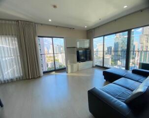 Modern living room with large windows and city view