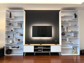 Modern living room with built-in shelves and TV