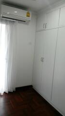 Bedroom with built-in wardrobe and air conditioning