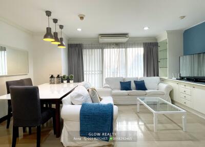 Modern living room with dining area and natural lighting