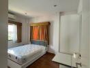 Spacious bedroom with double bed and window