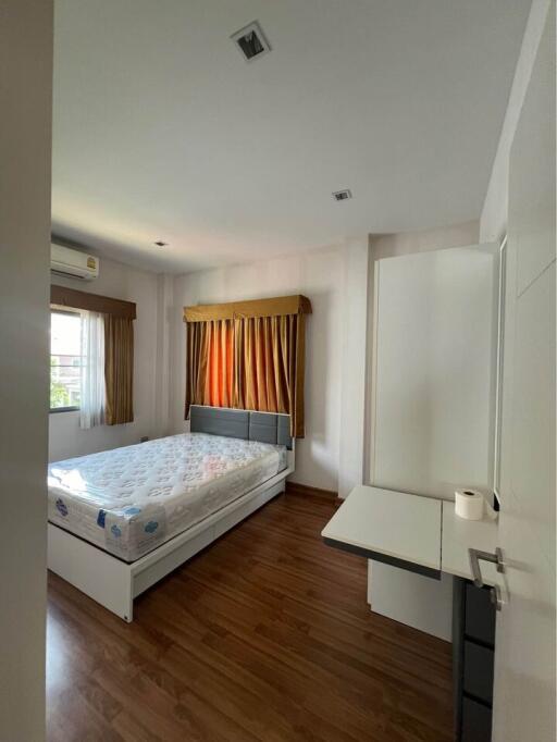 Spacious bedroom with double bed and window