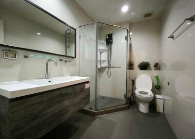 Modern bathroom with glass shower and large vanity