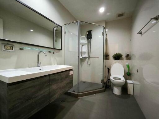 Modern bathroom with glass shower and large vanity