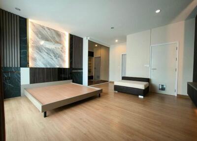 Spacious modern bedroom with bed and minimalist decor