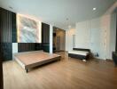 Spacious modern bedroom with bed and minimalist decor
