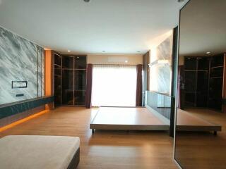 Modern living room with hardwood floors and large window