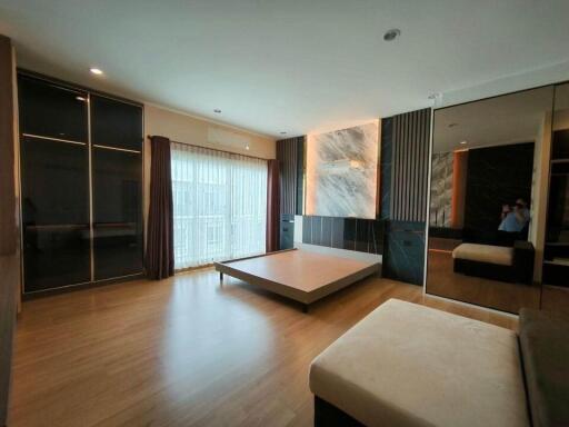 Modern bedroom with large windows and minimalist design