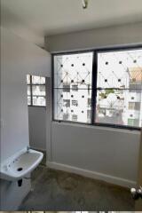 Bathroom with a window and a sink