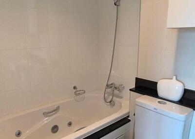 Modern bathroom with a bathtub and toilet