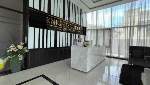 Lobby area with reception desk at Knightsbridge