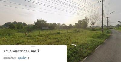 Countryside road and grassy field