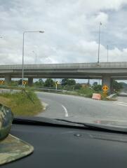 View of an overpass from inside a vehicle