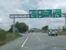 View of a road with directional signs to Rayong, Sattahip, and Pattaya