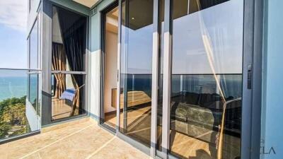Balcony with glass doors and ocean view