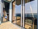 Balcony with glass doors and ocean view