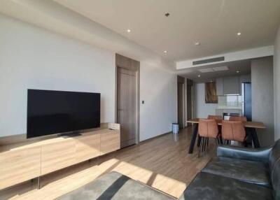 Modern living room with dining area and television