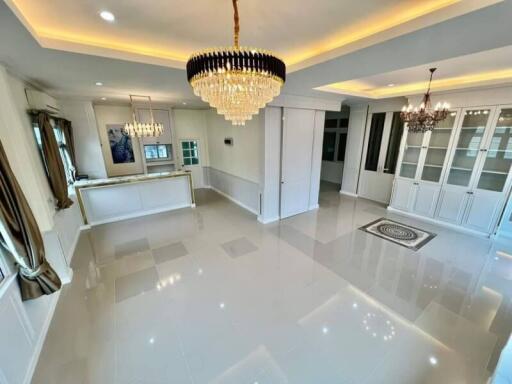 Spacious and elegant main living area with chandeliers