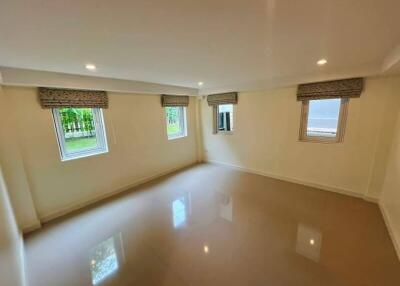 Spacious empty bedroom with windows